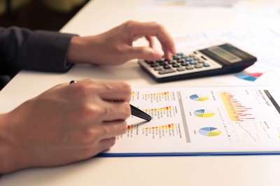 Businessman analyzing report, business performance concept