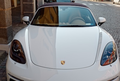 White Porsche car on the city pavement
